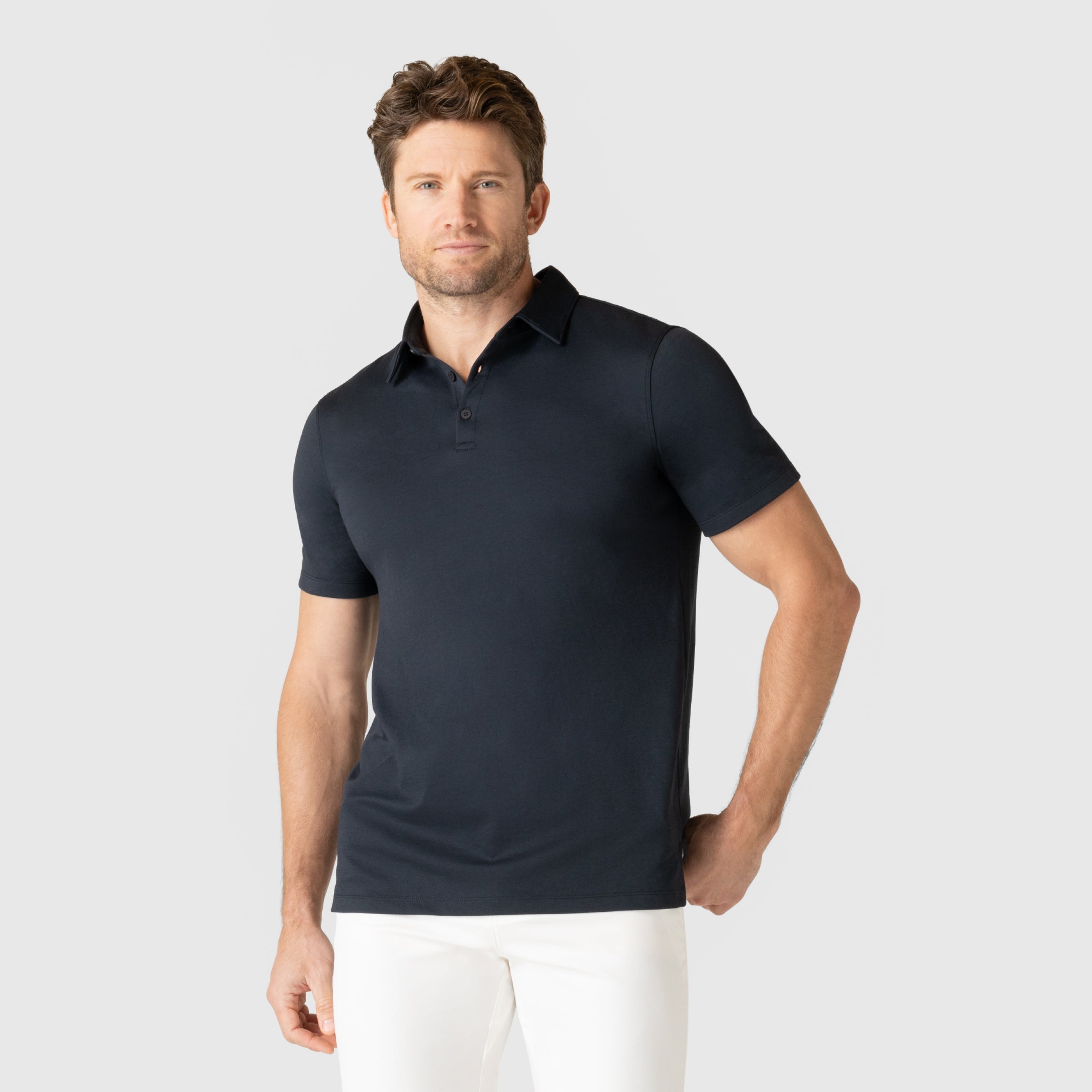 Men's Jetsetter Tech Polo in black with a tailored fit, perfect for work or travel.