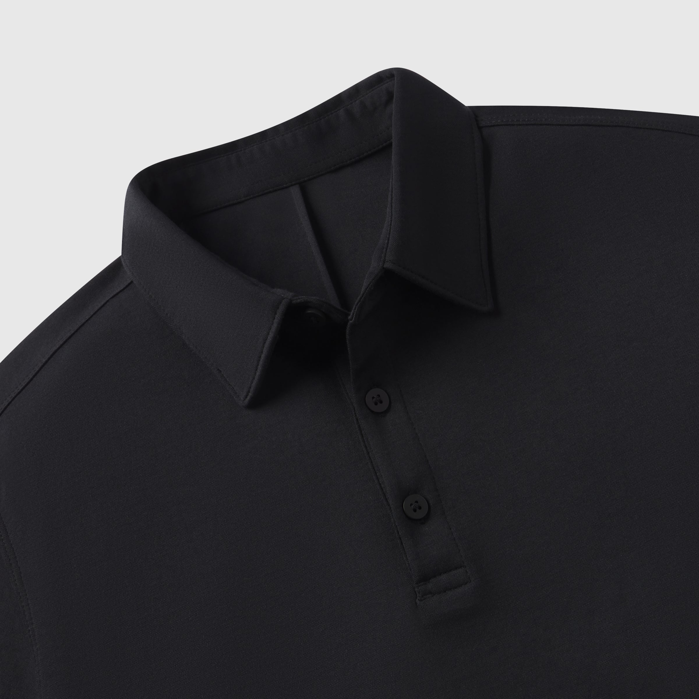 Black Tech Polo with structured collar and tailored fit.