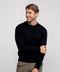 A man wearing the Anytime Crewneck Sweater in True Black