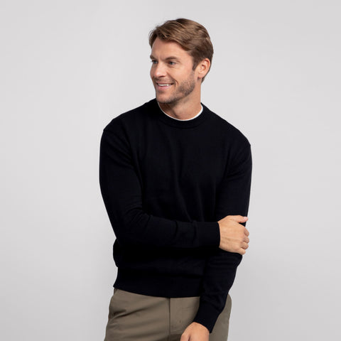 A man wearing the Anytime Crewneck Sweater in True Black