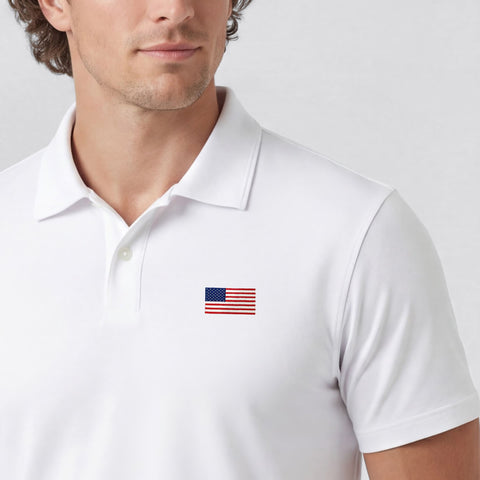 A man wearing the Clubhouse Pique Polo USA Flag in True White.