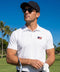 A man wearing the Clubhouse Pique Polo outdoors.