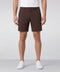 A man wearing the Jetsetter Tech Short 7 inches in Bourbon Brown