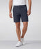 A man wearing the Jetsetter Tech Short 7" in Deep Blue