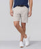 A man wearing the Jetsetter Tech Short 7" in Sand Stone