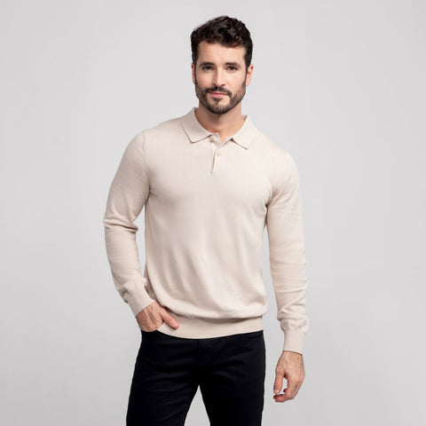 A man wearing the Legacy Polo Sweater in Beige
