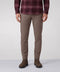 A man wearing Jack Archer Charter Twill Pant in Deep Taupe against a light background.