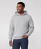 A man in a heather gray hooded sweatshirt and navy pants, smiling and looking to the side.