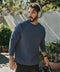 Man wearing the Sandwash Crewneck in Tidal Blue