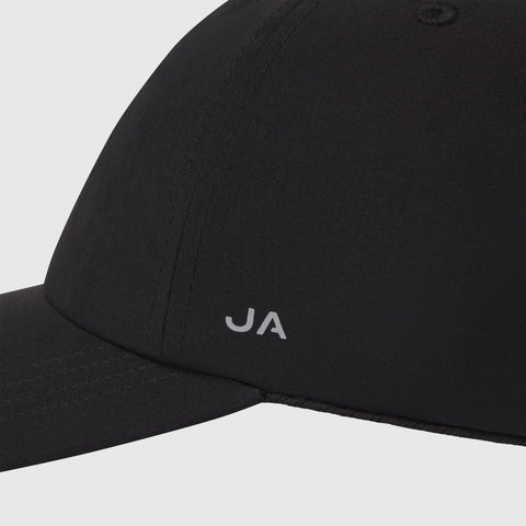 Black Anytime Hat with waterproof material and adjustable velcro strap.