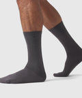 Men wearing grey Anytime Socks made from silky Pima cotton.
