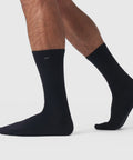 Pima cotton black Anytime Socks on feet, showing durability and breathability.