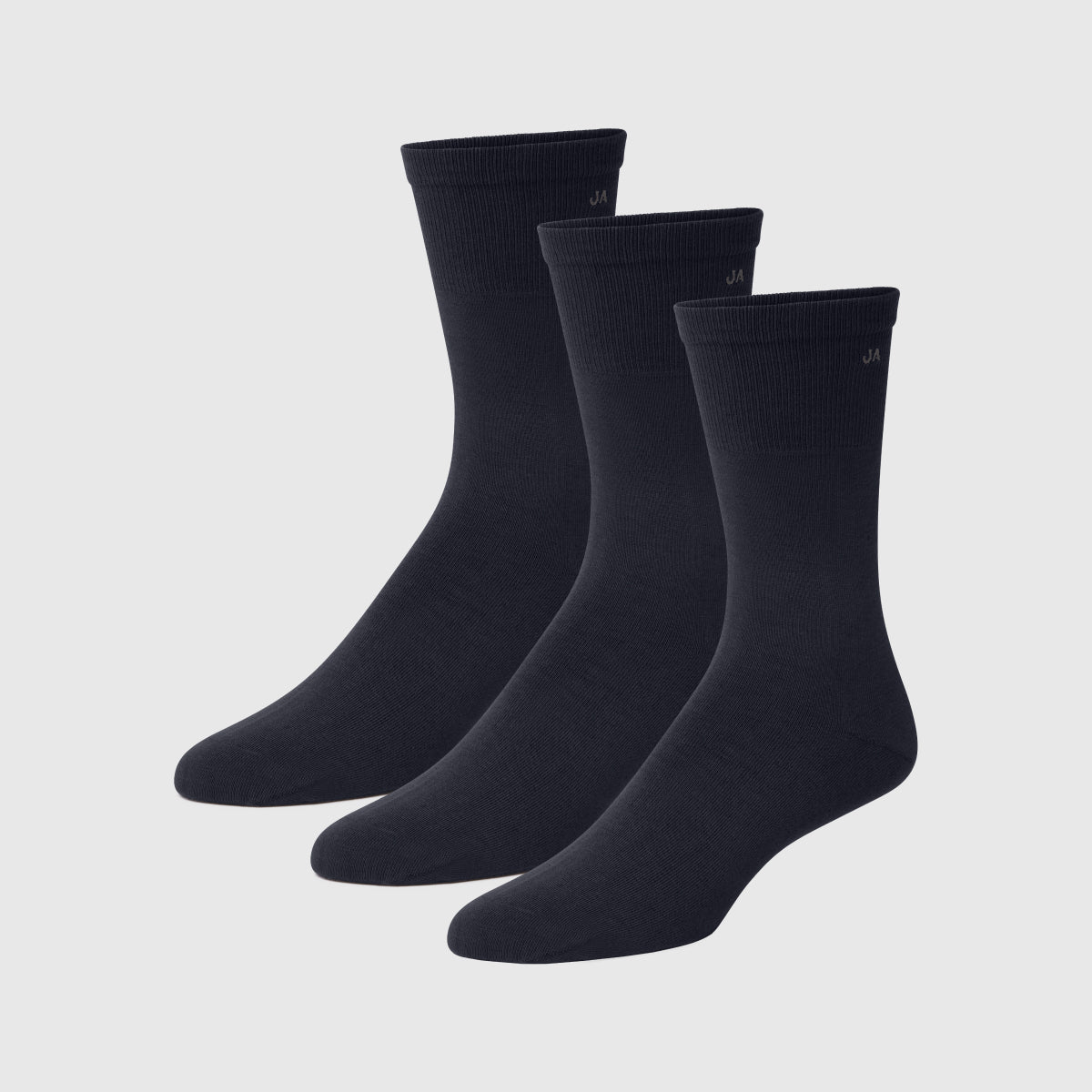 Three pairs of plain black socks displayed on a white background.