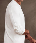 Precision Long Sleeve Tee in white, made from organic cotton, showcasing comfortable fit and wrinkle-resistant design.