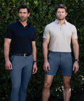 Men wearing Jetsetter Tech Shorts in outdoor setting.