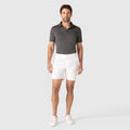 Man wearing Jetsetter Tech Short in white, showcasing a flattering fit and durable fabric.