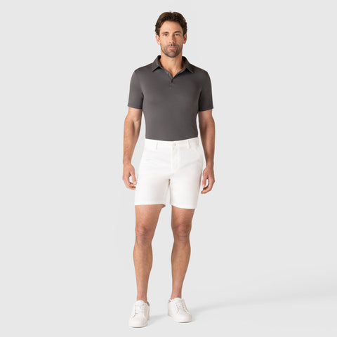 Man wearing Jetsetter Tech Short in white, showcasing a flattering fit and durable fabric.
