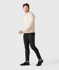 Man wearing the Legacy Polo Sweater in beige, made from premium viscose blend.