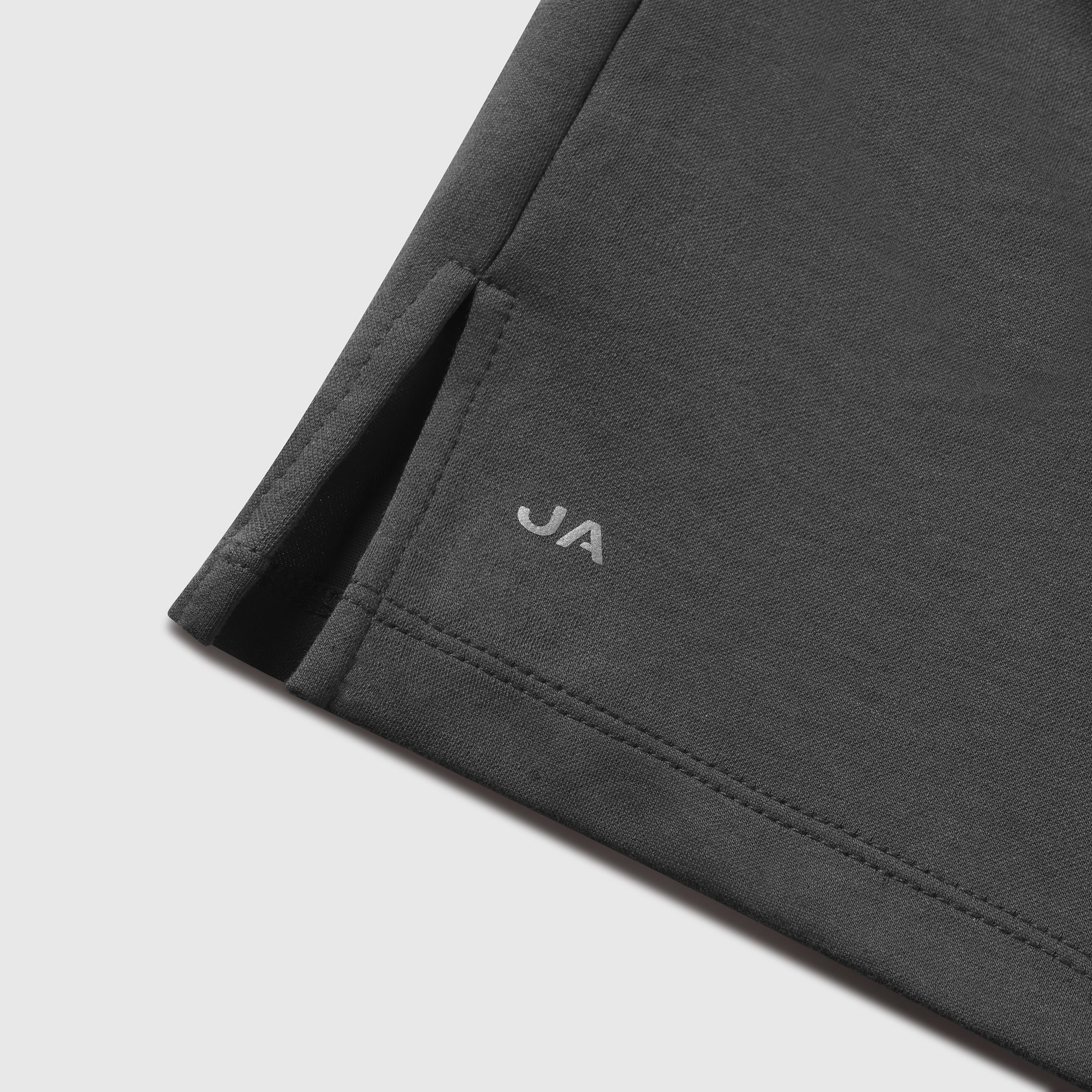Dark grey Tech Polo featuring tailored stitching and subtle logo detail.