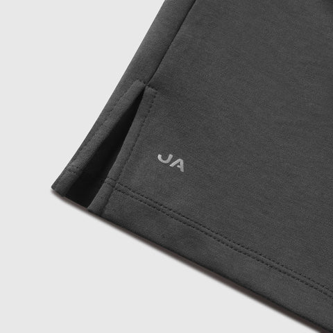 Dark grey Tech Polo featuring tailored stitching and subtle logo detail.