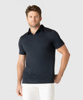 Men's Jetsetter Tech Polo in black with a tailored fit, perfect for work or travel.