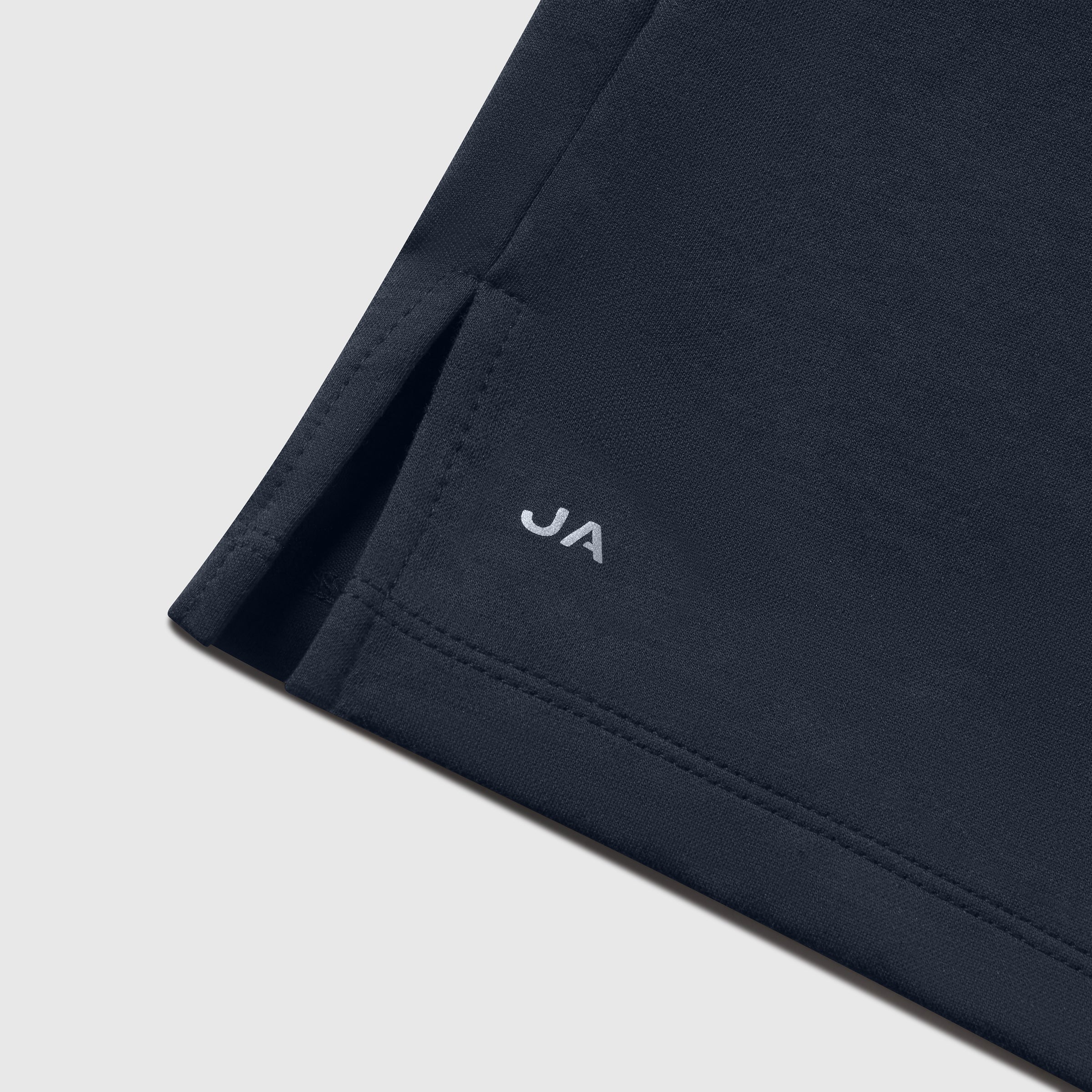 Jetsetter Tech Polo with tailored cut, structured collar, and branded hem detail.