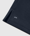 Jetsetter Tech Polo with tailored cut, structured collar, and branded hem detail.