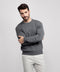 A man wearing the Anytime Crewneck Sweater in Gray Heather
