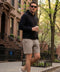 A man wearing the Atlas Short in Desert Taupe, outdoor setting