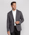 A man wearing the Jetsetter Blazer in Charcoal Gray, front view
