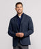 A man wearing the Jetsetter Blazer in Deep Blue