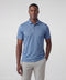A man wearing the Clubhouse Pique Polo in Bering Sea Gridline