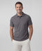 A man wearing the Clubhouse Pique Polo in Charcoal Gray