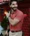 A man in the Clubhouse Pique Polo Red Brick line, outdoor setting