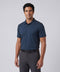 A man wearing the Clubhouse Pique Polo in Tidal Blue