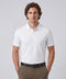 A man wearing the Clubhouse Pique Polo in True White
