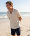 A man wearing the Getaway Linen Shirt in Canvas
