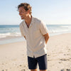 A man wearing the Getaway Linen Shirt in Canvas
