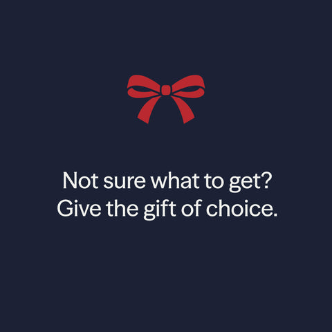 Not sure what to get? Give the gift of choice. A red gift bow on a navy background.