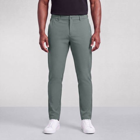 A man wearing the Jetsetter Tech Pant Straight Fit in Storm Green, front view