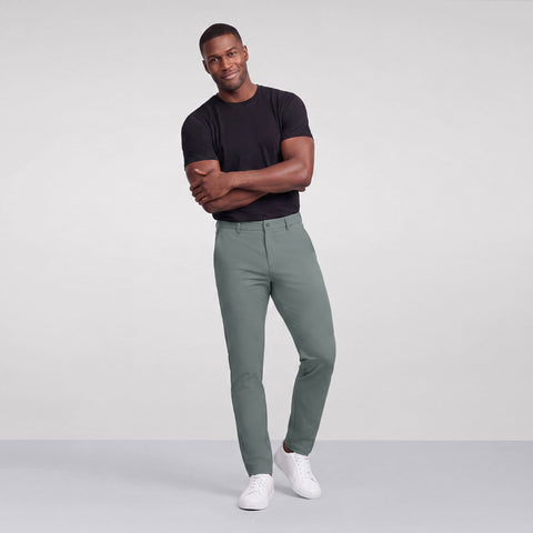 Side view of a man in the Jetsetter Tech Pant Slim Fit, Storm Green