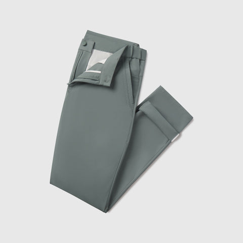The Jetsetter Tech Pant Slim Fit in Storm Green on a white background