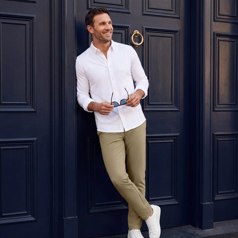 A man wearing the Jetsetter Tech Pant Straight Fit in True Khaki outdoors