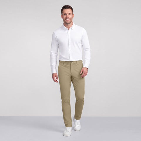 A man in the Jetsetter Tech Pant Slim Fit, True Khaki lifestyle shot