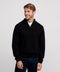 A man wearing the Jetsetter Quarter-Zip Sweater in True Black