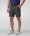 A man wearing the Jetsetter Tech Short 7" in Charcoal Gray