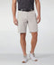 A man wearing the Jetsetter Tech Short 9 inches in Sand Stone