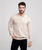 A man wearing the Legacy Polo Sweater in Beige