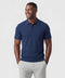 A man wearing the Legacy Resort Polo in Harbor Blue