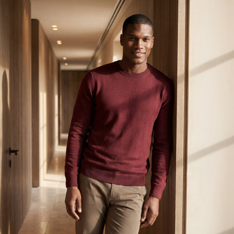 A man wearing the Anytime Crewneck Sweater in Maroon in a lifestyle setting